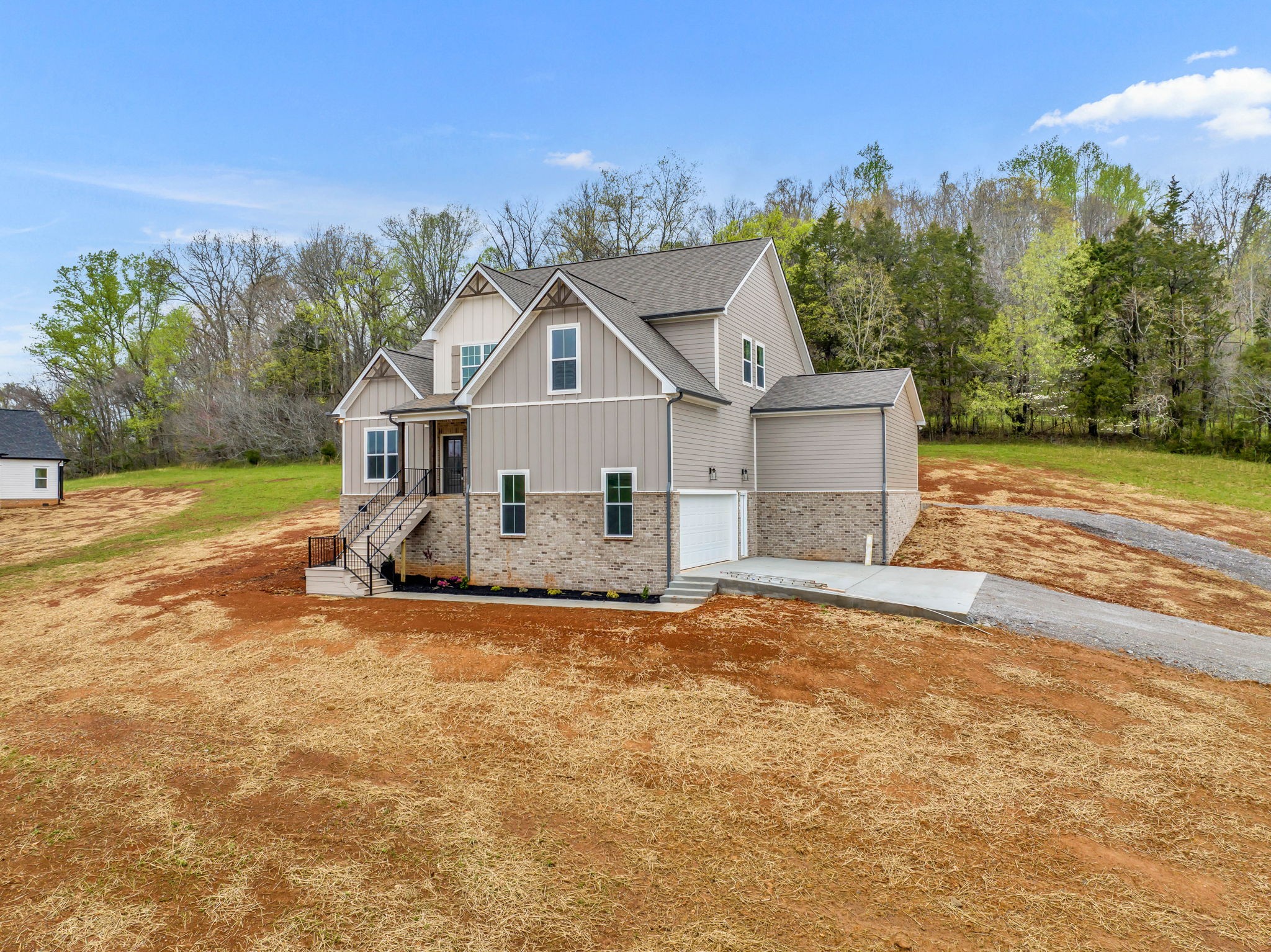 303 Noah Road Manchester, TN 37355 - Photo 4 of 63 a view of a house with a yard and large tree