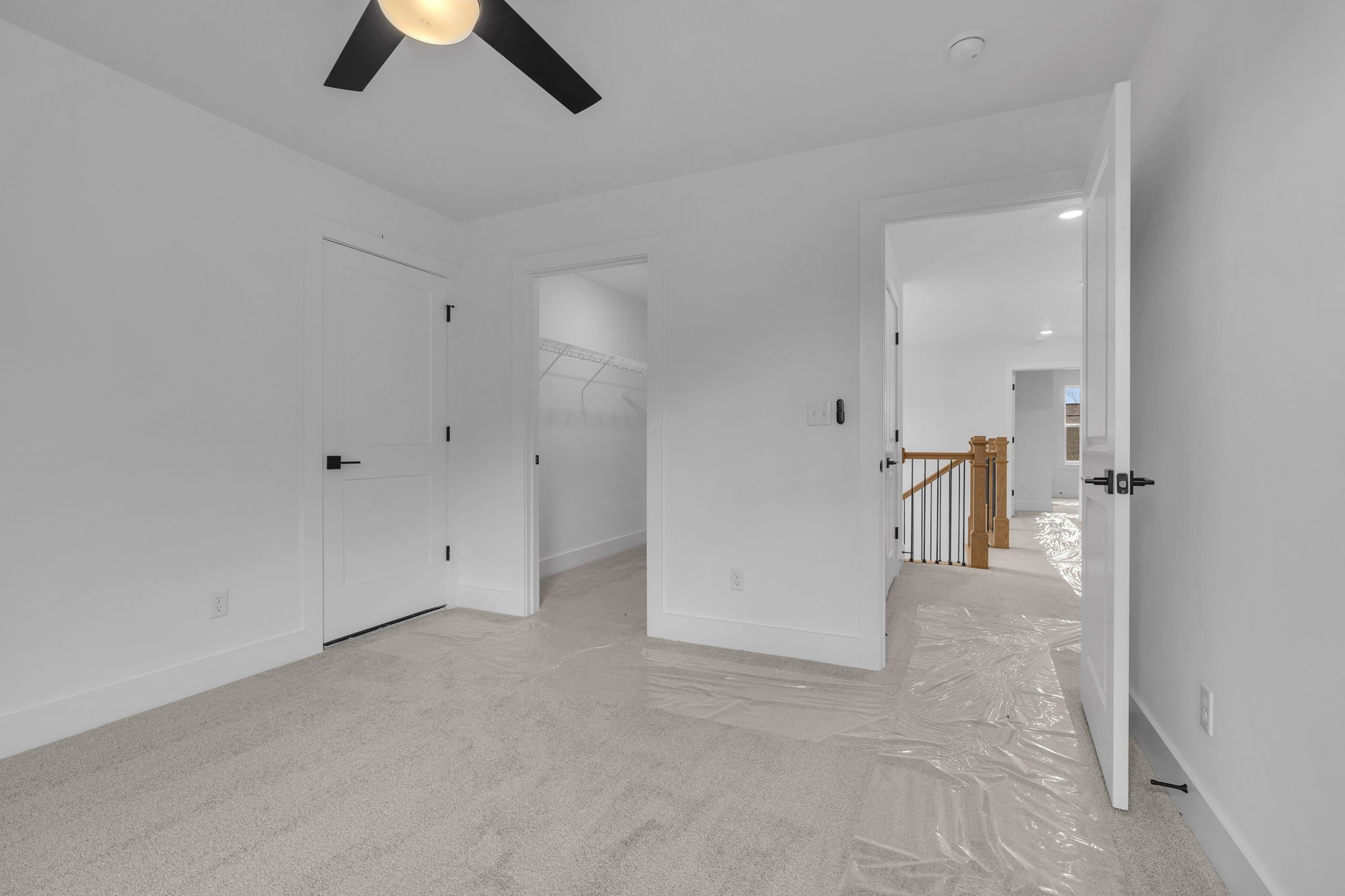 303 Noah Road Manchester, TN 37355 - Photo 42 of 63 an empty room with a ceiling fan and kitchen view