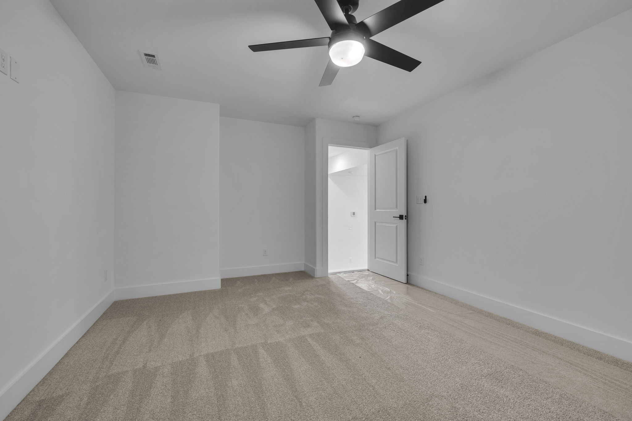 303 Noah Road Manchester, TN 37355 - Photo 50 of 63 an empty room with a ceiling fan and a window