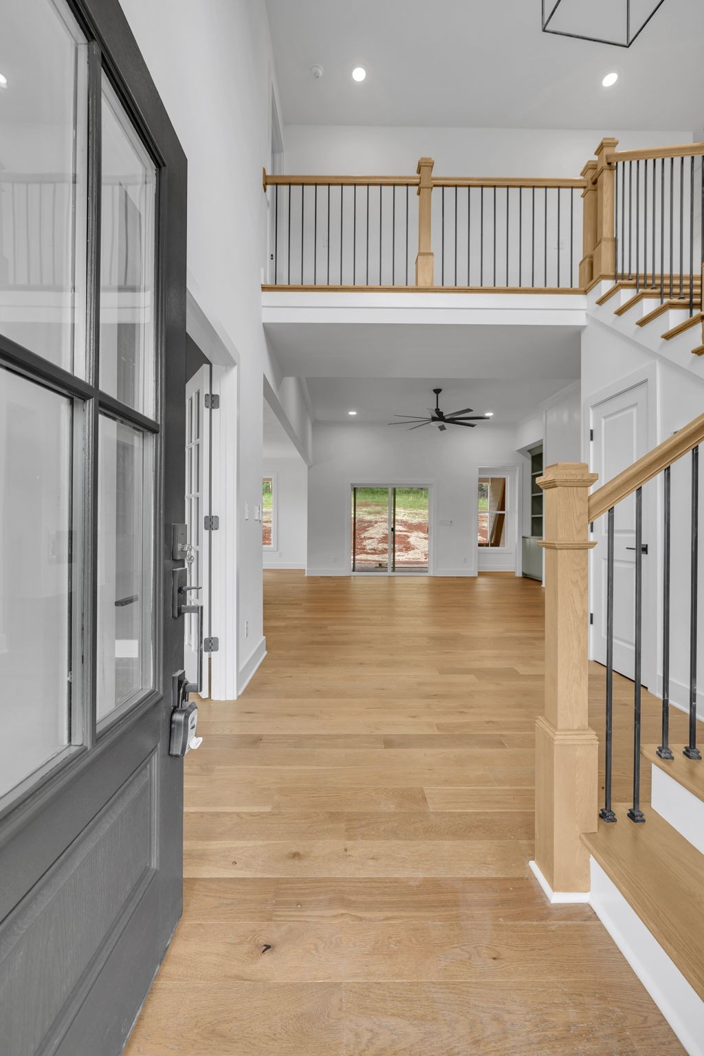 303 Noah Road Manchester, TN 37355 - Photo 7 of 63 a view of a hallway with entryway wooden floor and front door