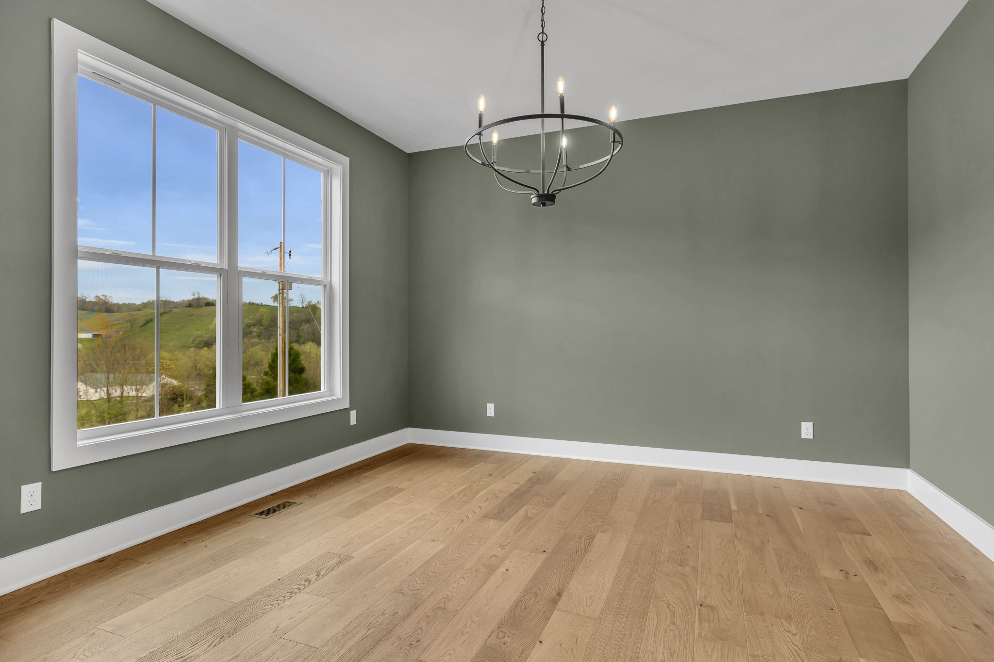 303 Noah Road Manchester, TN 37355 - Photo 9 of 63 an empty room with a empty space and windows