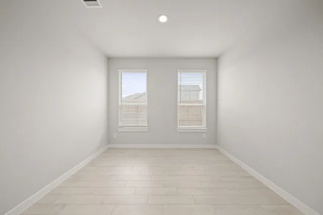 an empty room with windows