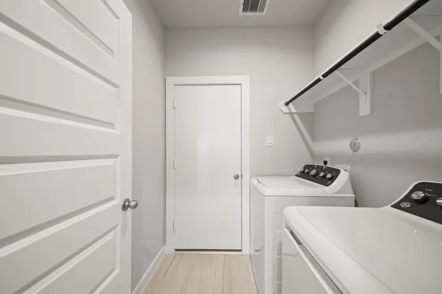 a view of storage and utility room with empty racks