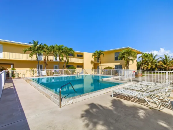 a view of a swimming pool with a lounge chair