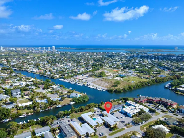 an aerial view of residential houses with outdoor space