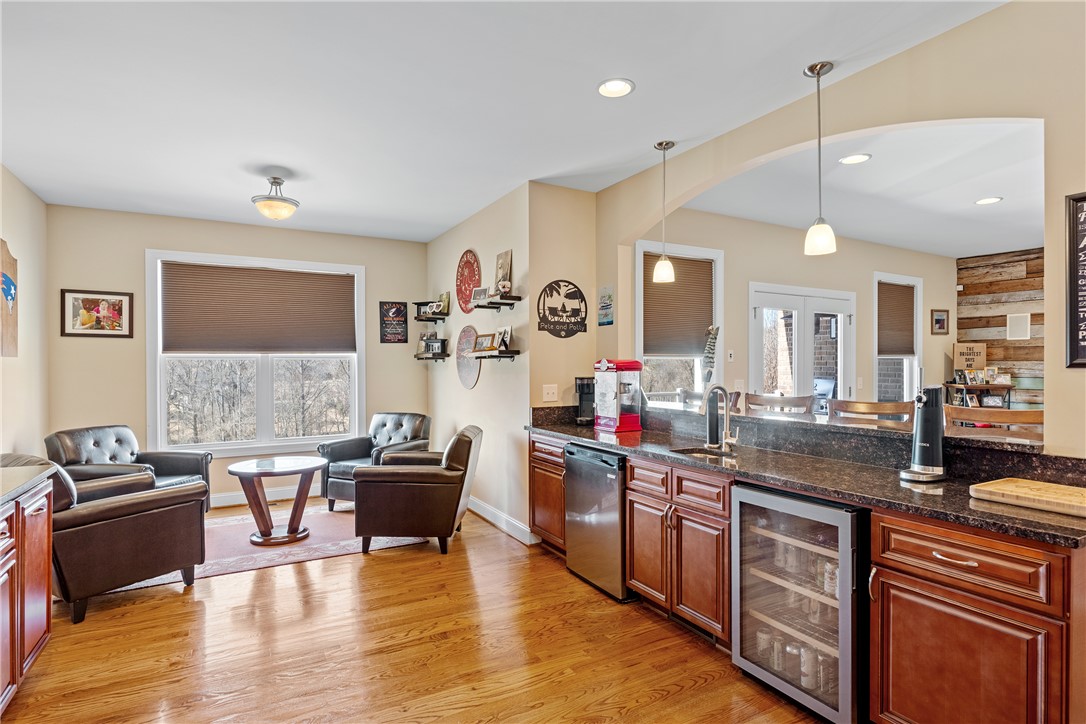 119 Turnberry Road Anderson, SC 29621 - Photo 32 of 50 This inviting space features rich hardwood flooring and a stylish wet bar, perfect for entertaining.