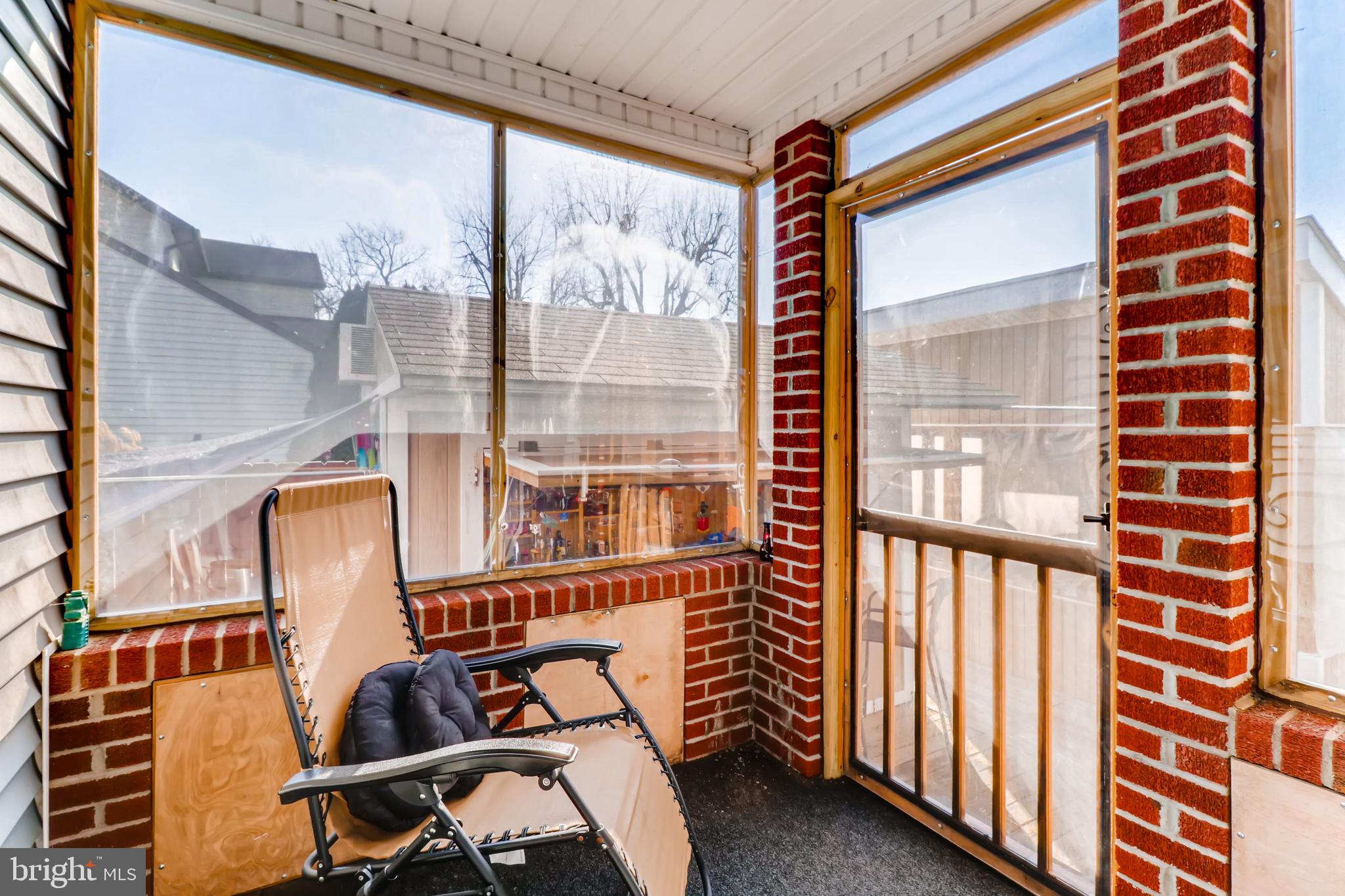 8211 Shore Road Baltimore, MD 21222 - Photo 22 of 46 Enclosed/screened sun porch off living room