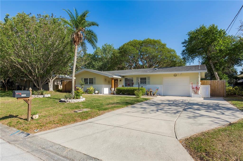 1141 Jackmar Road Dunedin, FL 34698 - Photo 1 of 1 Front exterior with extra parking pad on the right
