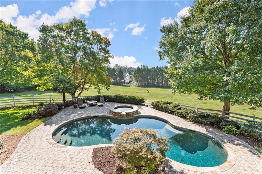 2035 Bethany Way Milton, GA 30004 - Photo 1 of 1 a view of a backyard with swimming pool and outdoor space
