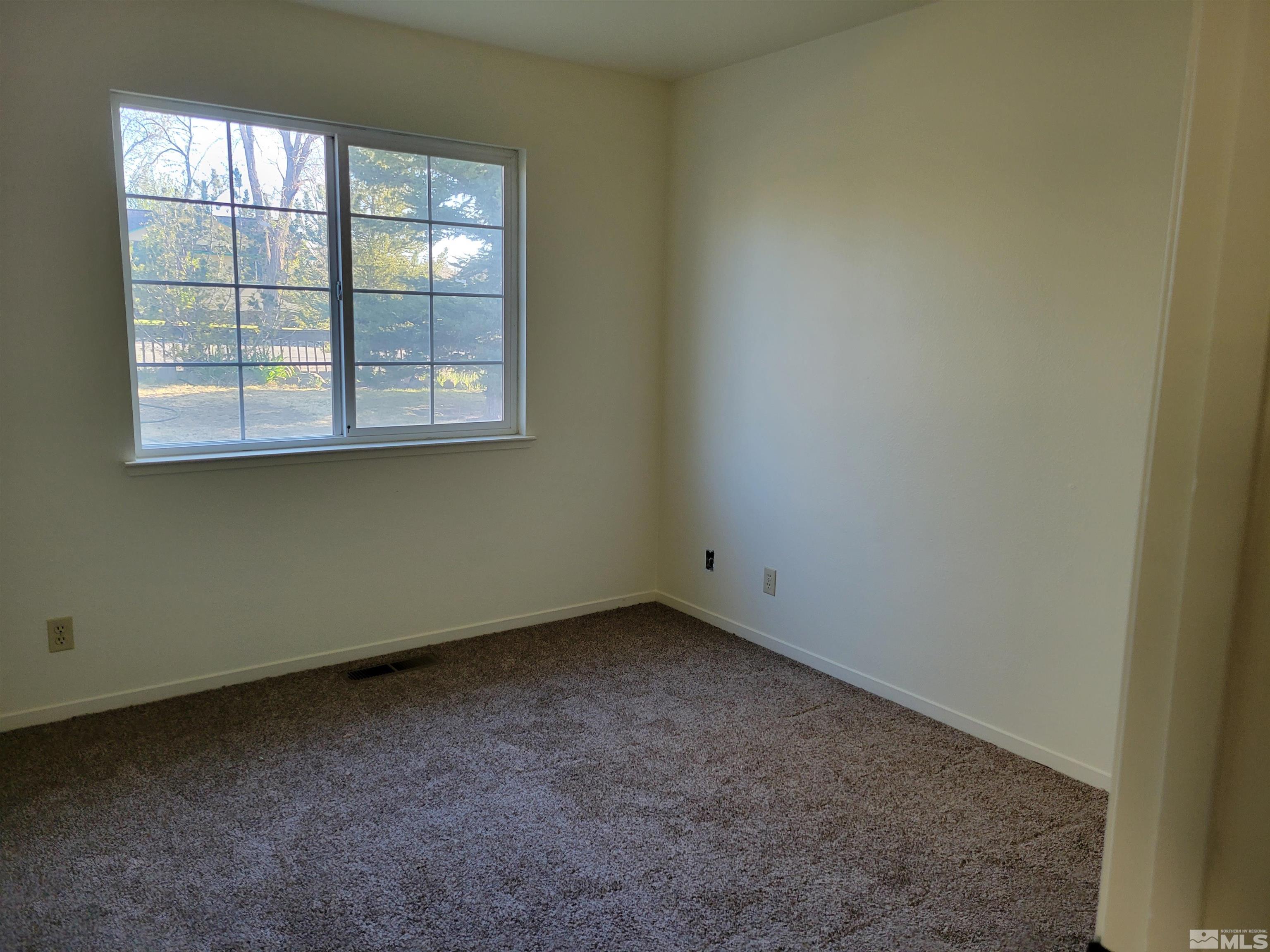 10405 Bounder Lane Reno, NV 89508 - Photo 13 of 16 an empty room with a window