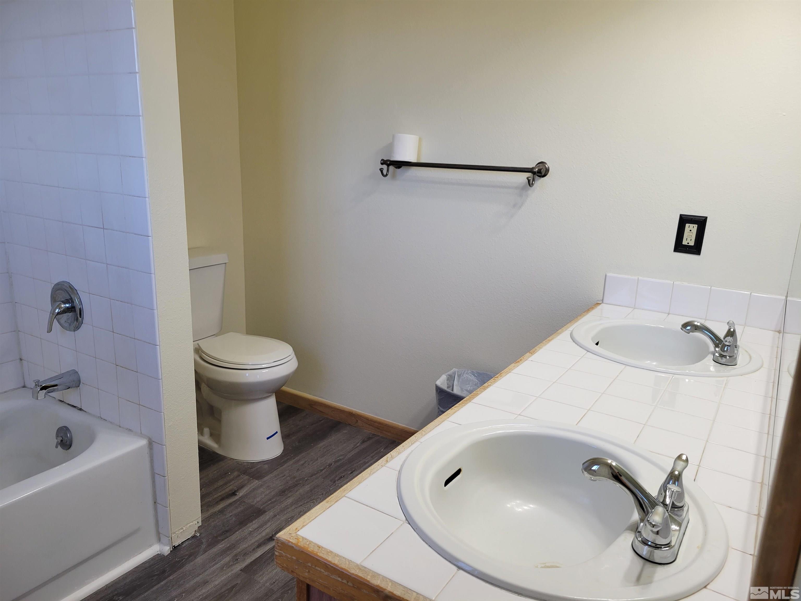 10405 Bounder Lane Reno, NV 89508 - Photo 16 of 16 a bathroom with a sink and a bathtub