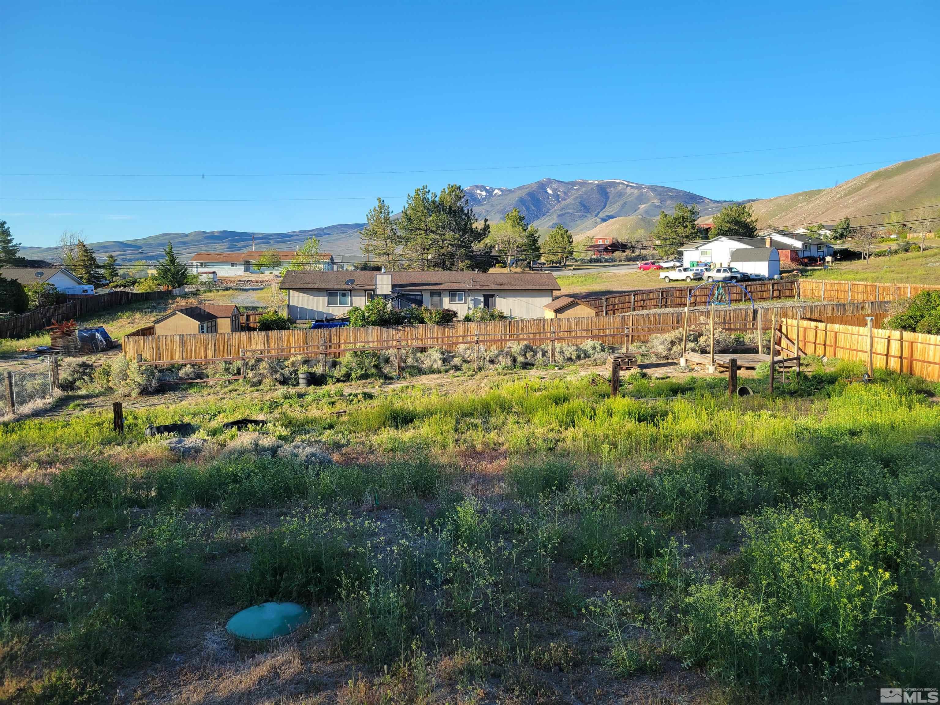 10405 Bounder Lane Reno, NV 89508 - Photo 8 of 16 a view of a lake with houses