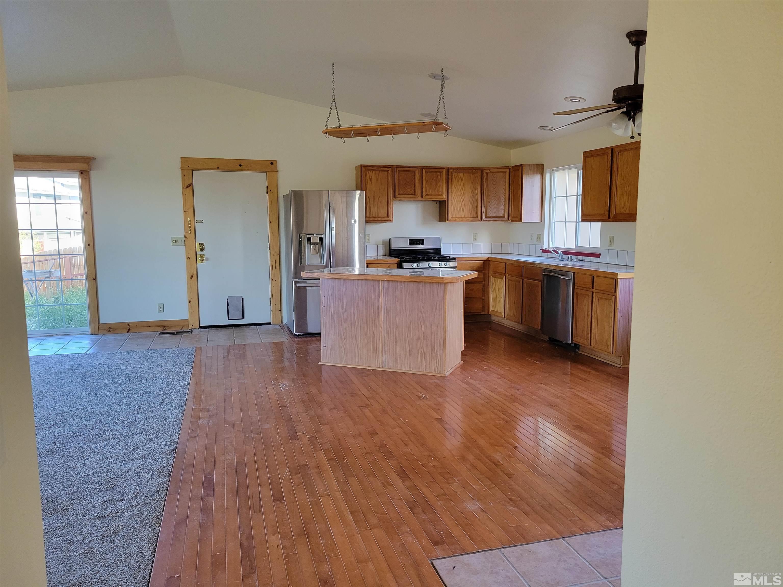 10405 Bounder Lane Reno, NV 89508 - Photo 9 of 16 a view of kitchen with sink microwave and stove