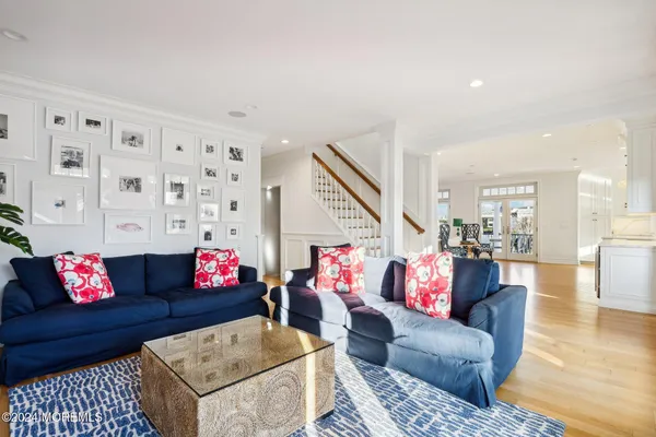 a spacious bedroom with a bed and a flat screen tv