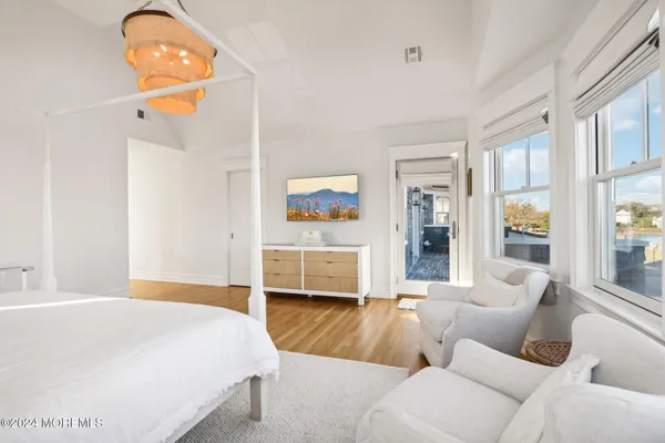 a bedroom with a bed and a table in it