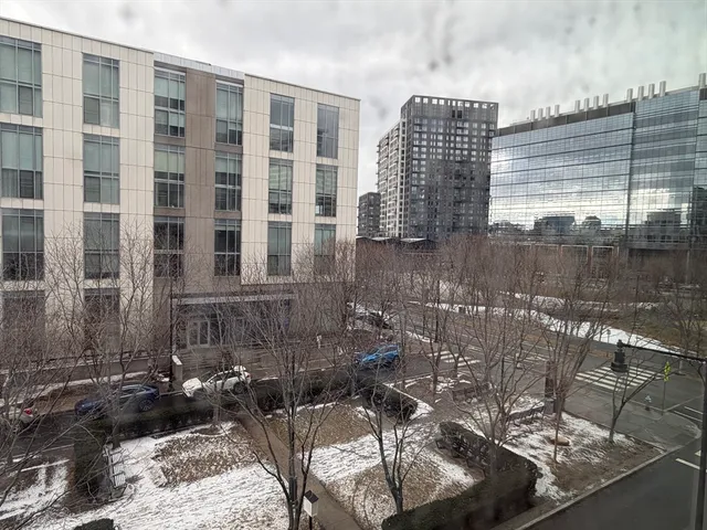 a view of parking garage with cars parked