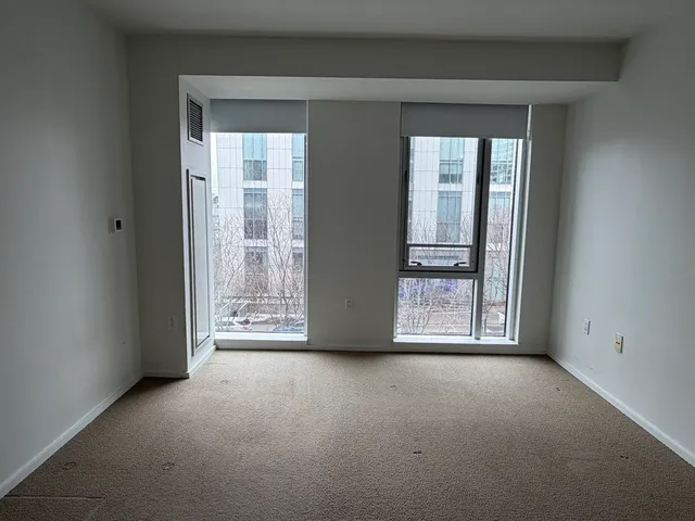 a view of an empty room with glass door