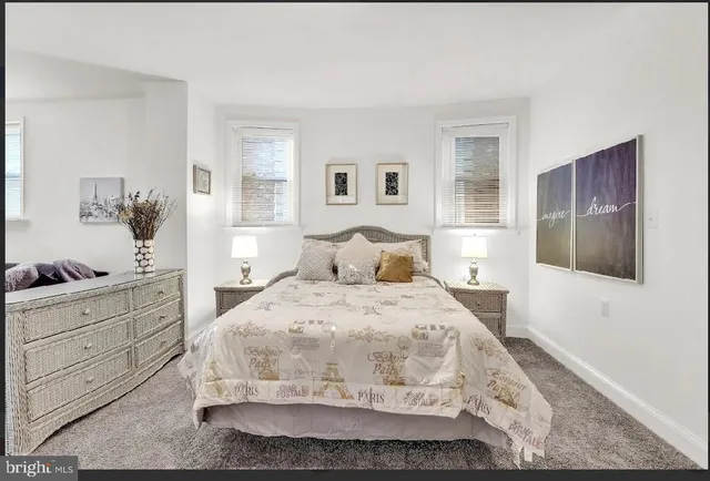 a large white bed in a white room