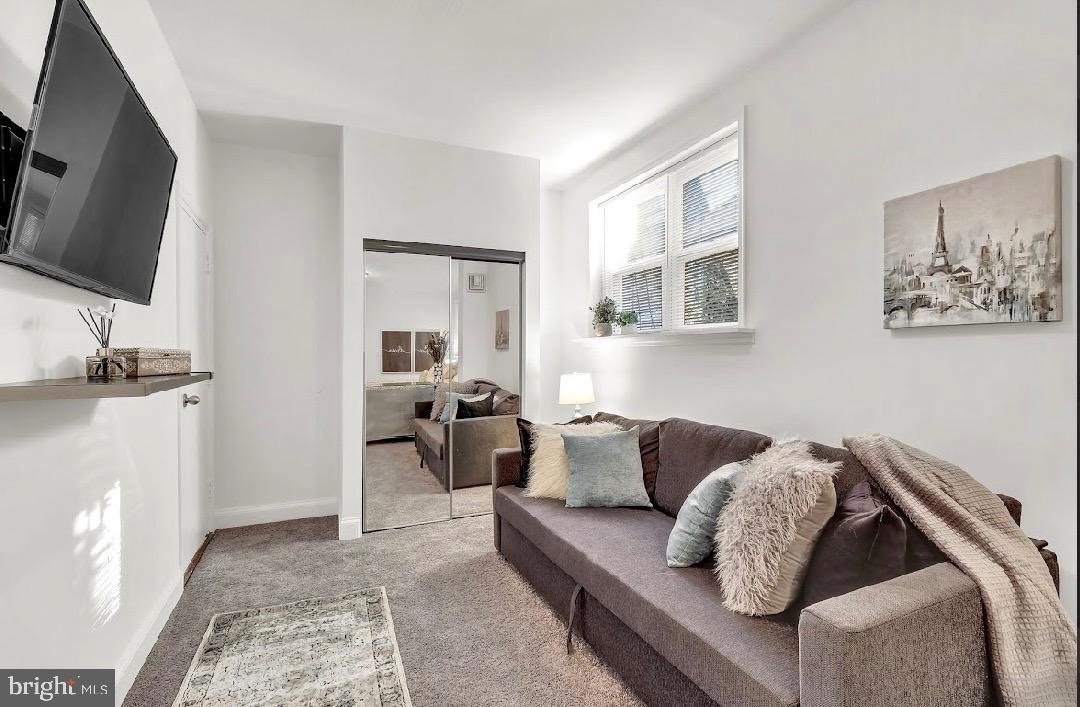 468 East Walnut Lane, Unit 1 Philadelphia, PA 19144 - Photo 17 of 17 a living room with furniture and a flat screen tv