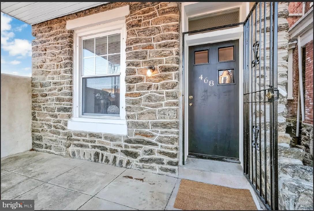 468 East Walnut Lane, Unit 1 Philadelphia, PA 19144 - Photo 3 of 17 a view of a brick house with large windows