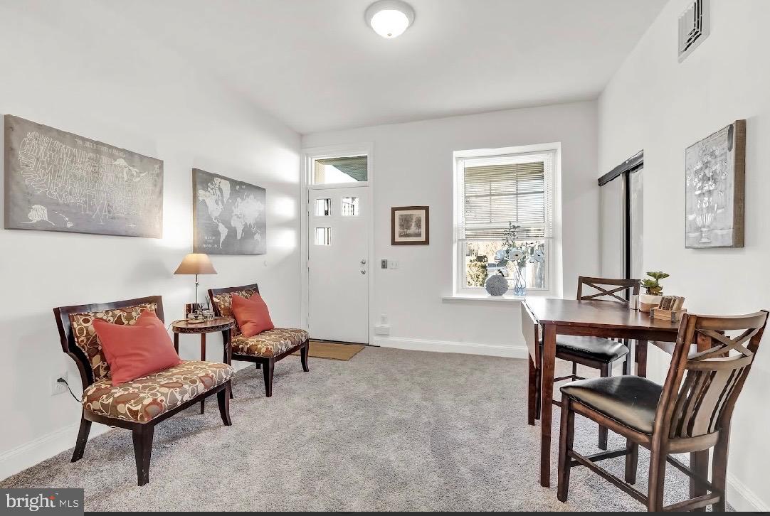 468 East Walnut Lane, Unit 1 Philadelphia, PA 19144 - Photo 4 of 17 a living room with furniture and a window