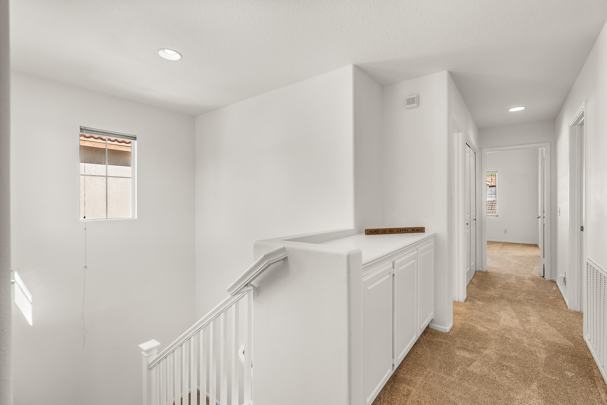 25803 Hammet Circle Stevenson Ranch, CA 91381 - Photo 17 of 32 a view of a kitchen with white cabinets