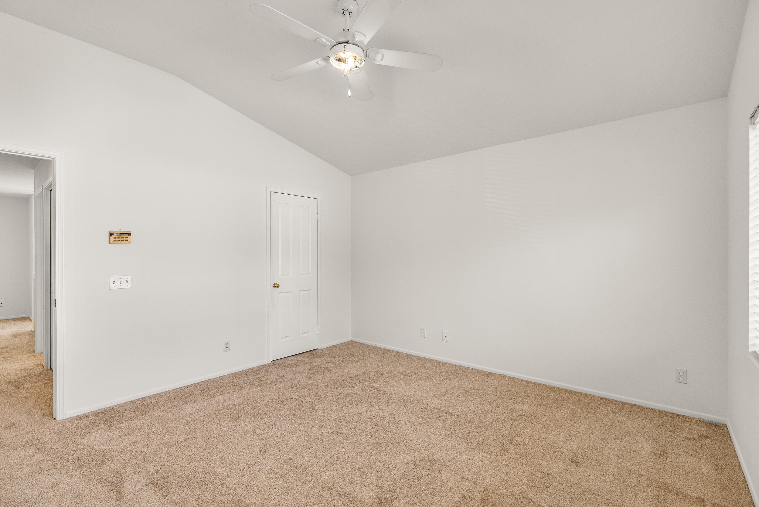25803 Hammet Circle Stevenson Ranch, CA 91381 - Photo 19 of 32 an empty room with a ceiling fan and a window