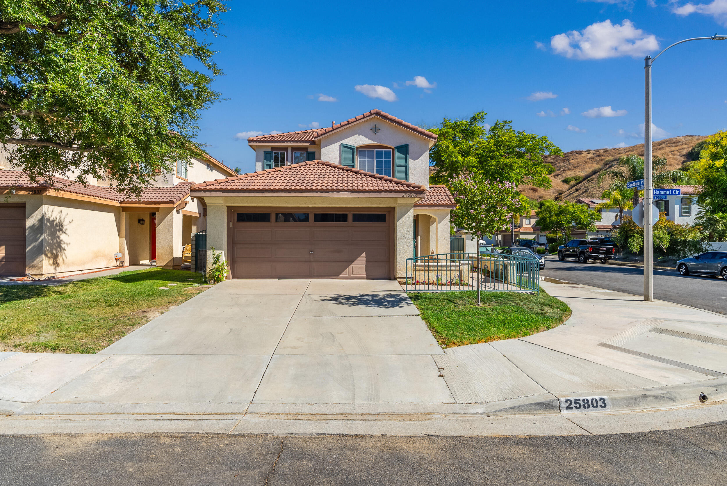 25803 Hammet Circle Stevenson Ranch, CA 91381 - Photo 2 of 32 a front view of a house with a yard and garage
