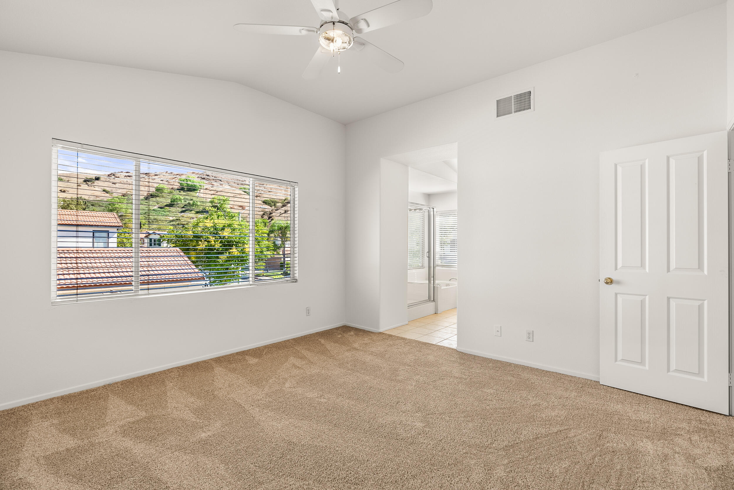 25803 Hammet Circle Stevenson Ranch, CA 91381 - Photo 21 of 32 a view of an empty room with a window