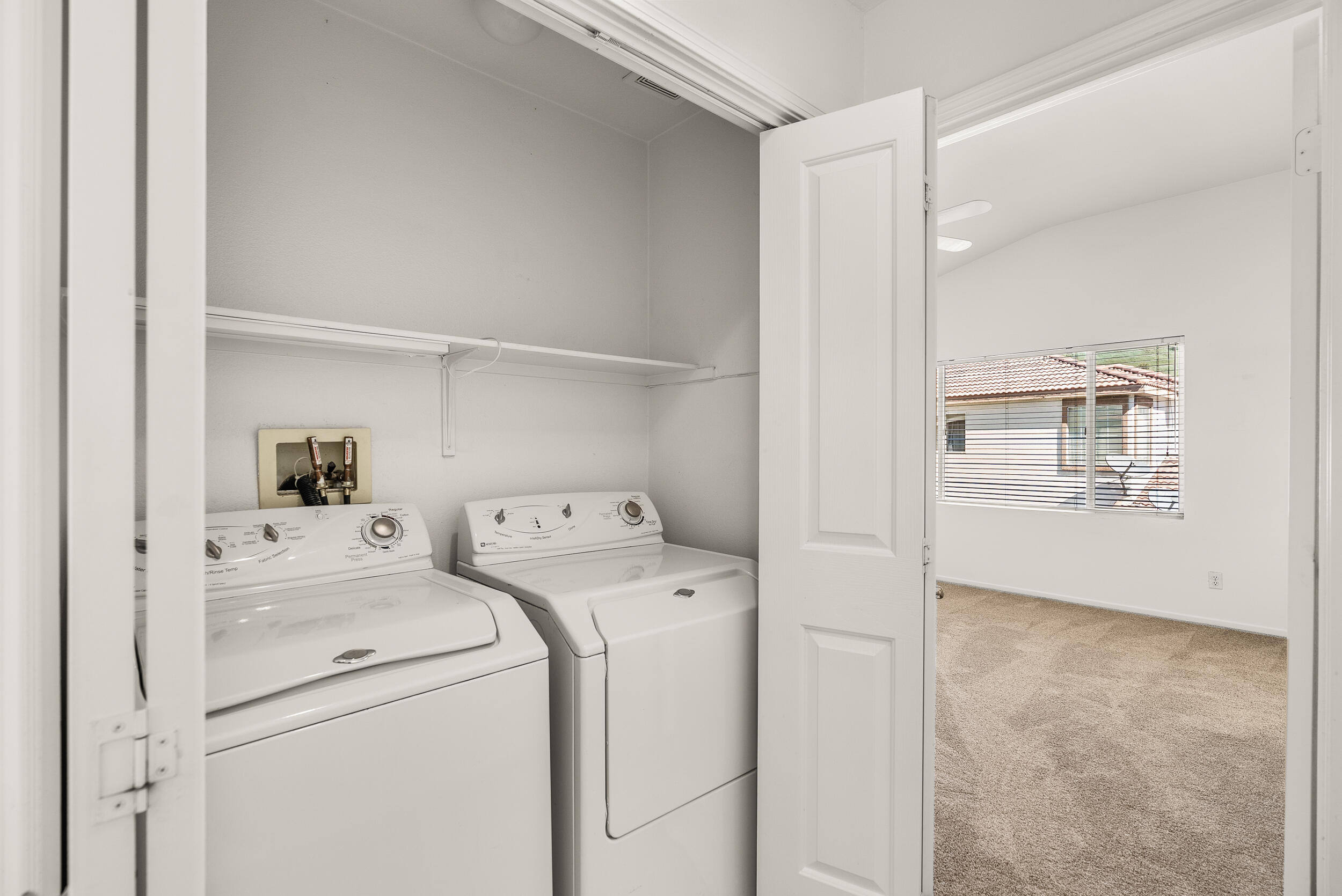 25803 Hammet Circle Stevenson Ranch, CA 91381 - Photo 27 of 32 a view of storage and utility room with washer and dryer