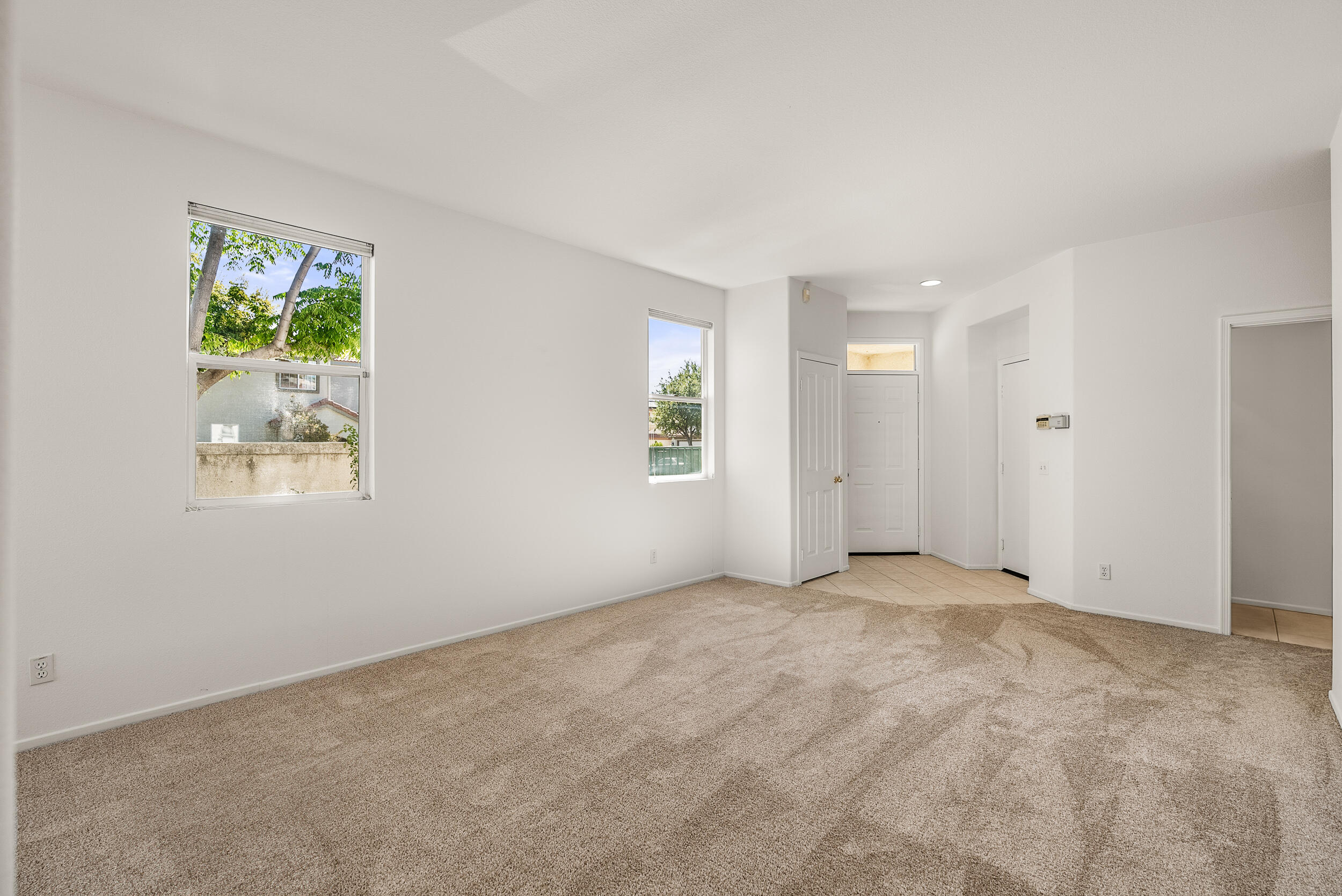 25803 Hammet Circle Stevenson Ranch, CA 91381 - Photo 6 of 32 an empty room with windows