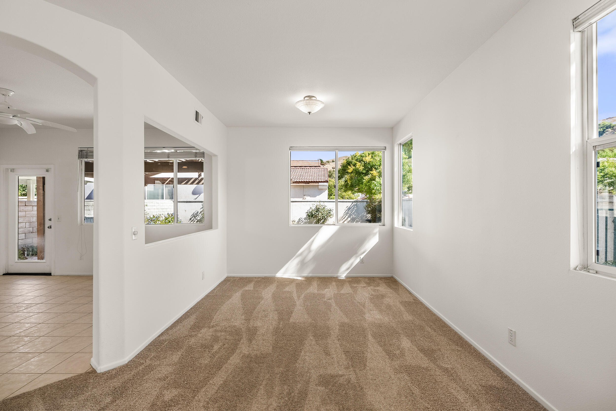 25803 Hammet Circle Stevenson Ranch, CA 91381 - Photo 7 of 32 wooden floor in an empty room with a window