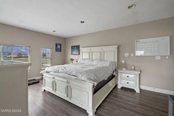 a room with a bed and a night stand