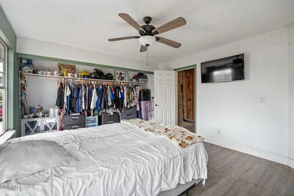 a bed room with a bed and a walk in closet