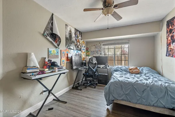 a bedroom with furniture and a window