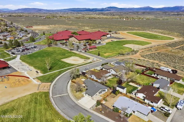 an aerial view of a house with a swimming pool