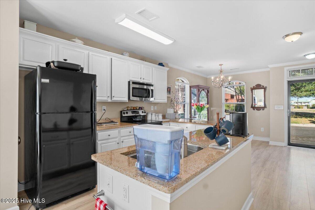 7650 Front Street, Unit 3 Sunset Beach, NC 28468 - Photo 7 of 37 Storm Door at Front Entryway