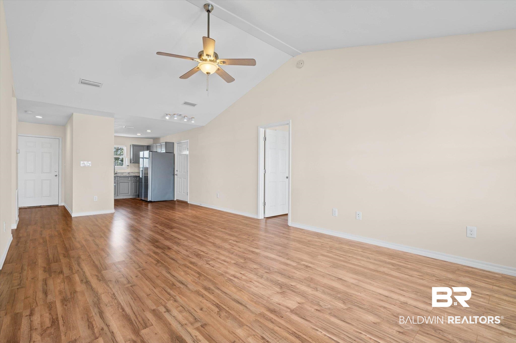 919 Sailor Circle Foley, AL 36535 - Photo 6 of 24 Unfurnished living room with light wood-style floors and ceiling fan