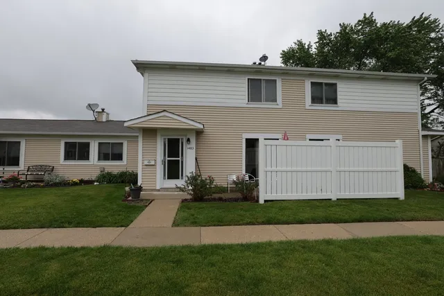 a view of a house with a yard