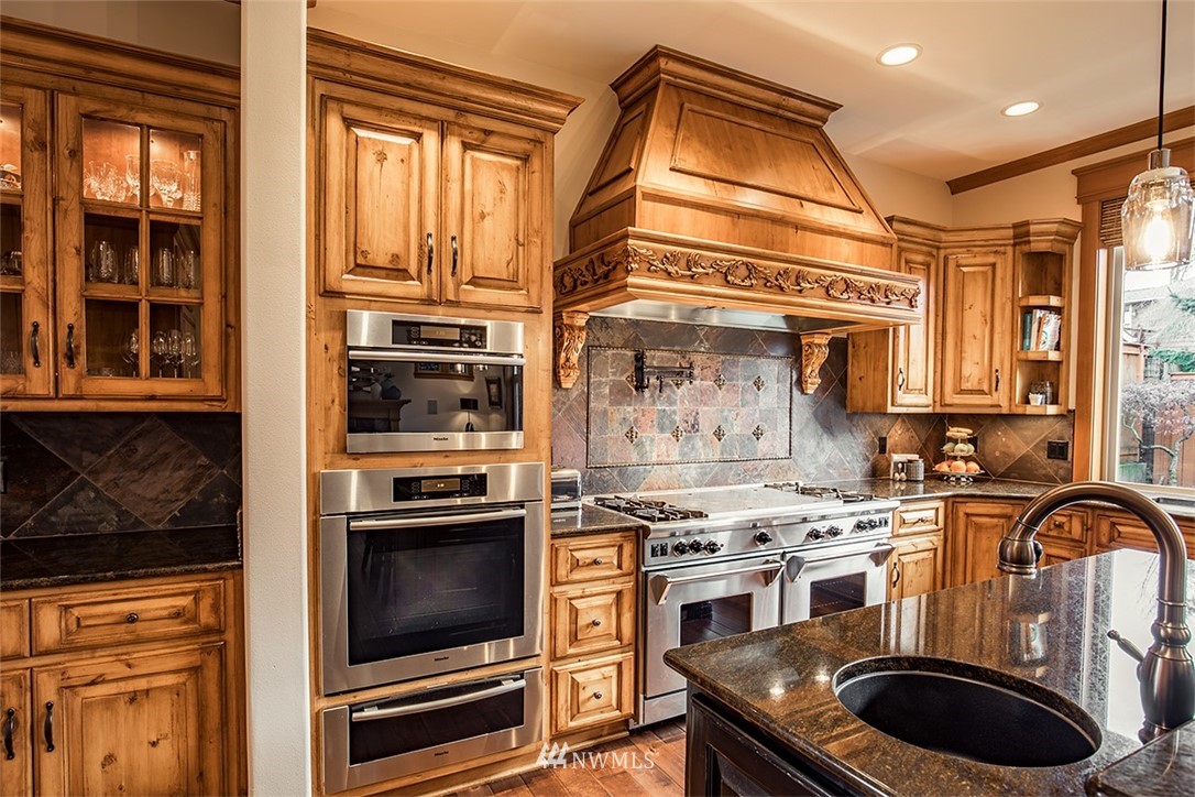 907 North 35th Street Renton, WA 98056 - Photo 14 of 37 a kitchen with a stove and a microwave