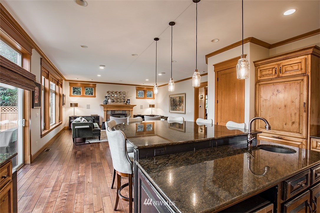 907 North 35th Street Renton, WA 98056 - Photo 16 of 37 a kitchen with stainless steel appliances granite countertop a sink a stove and a wooden floors