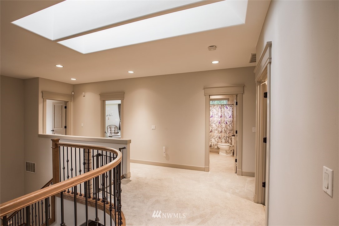 907 North 35th Street Renton, WA 98056 - Photo 23 of 37 a view of a hallway with windows