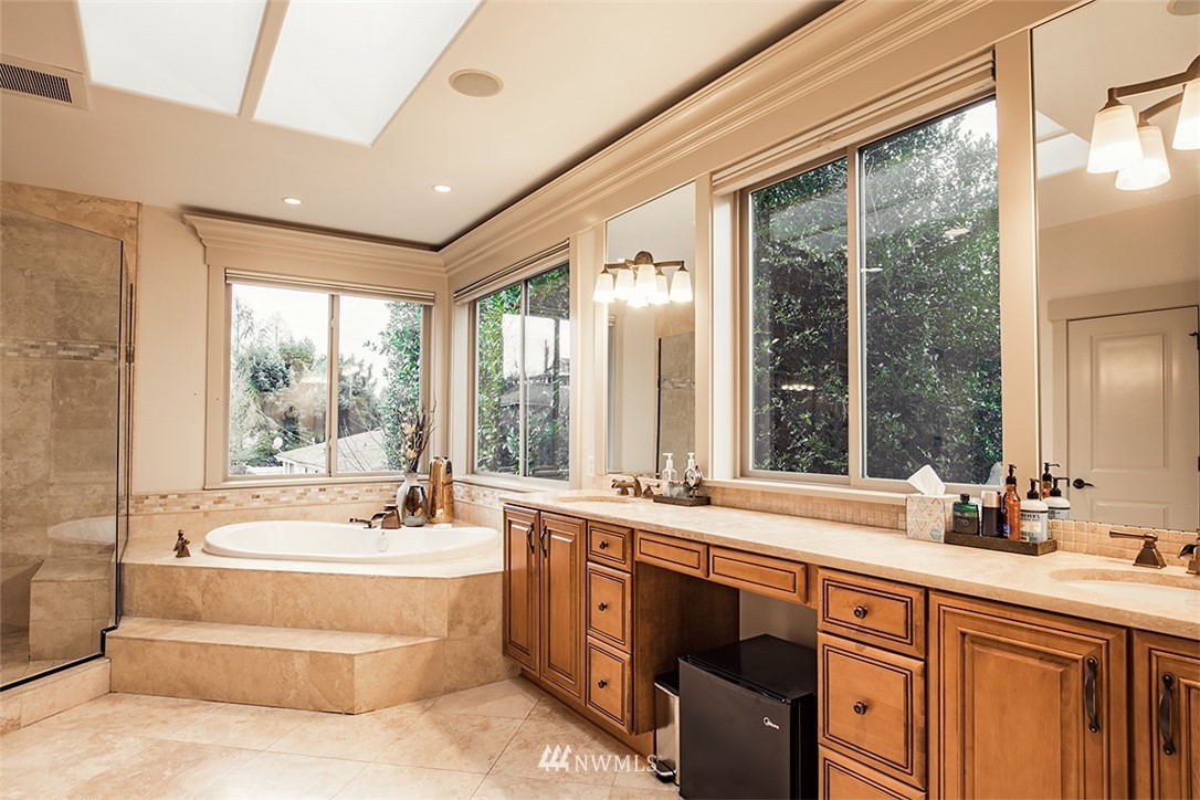 907 North 35th Street Renton, WA 98056 - Photo 26 of 37 a spacious bathroom with a double vanity sink large mirror and a large window