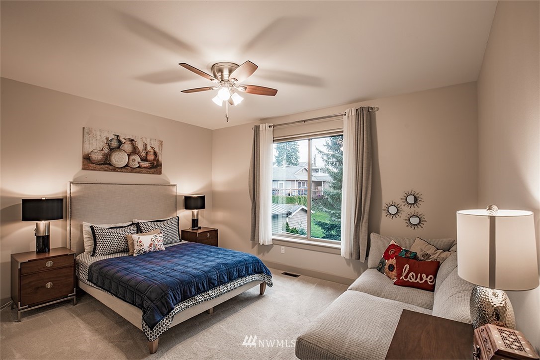 907 North 35th Street Renton, WA 98056 - Photo 28 of 37 a bedroom with a bed couch and window