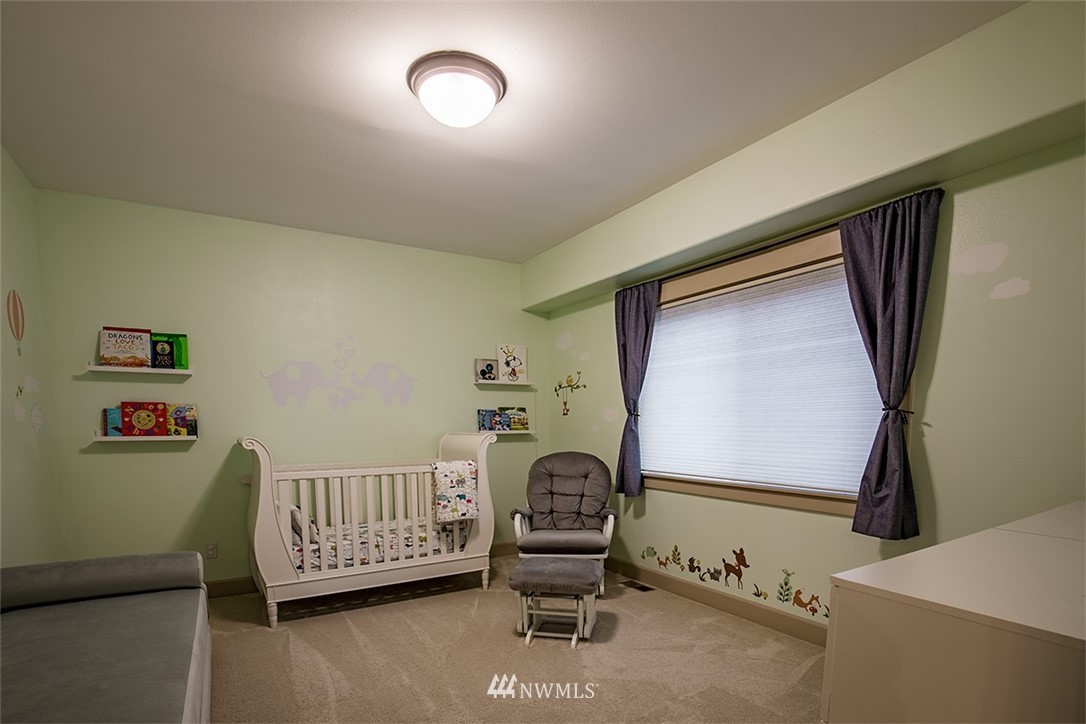 907 North 35th Street Renton, WA 98056 - Photo 30 of 37 a view of a bedroom with furniture and staircase