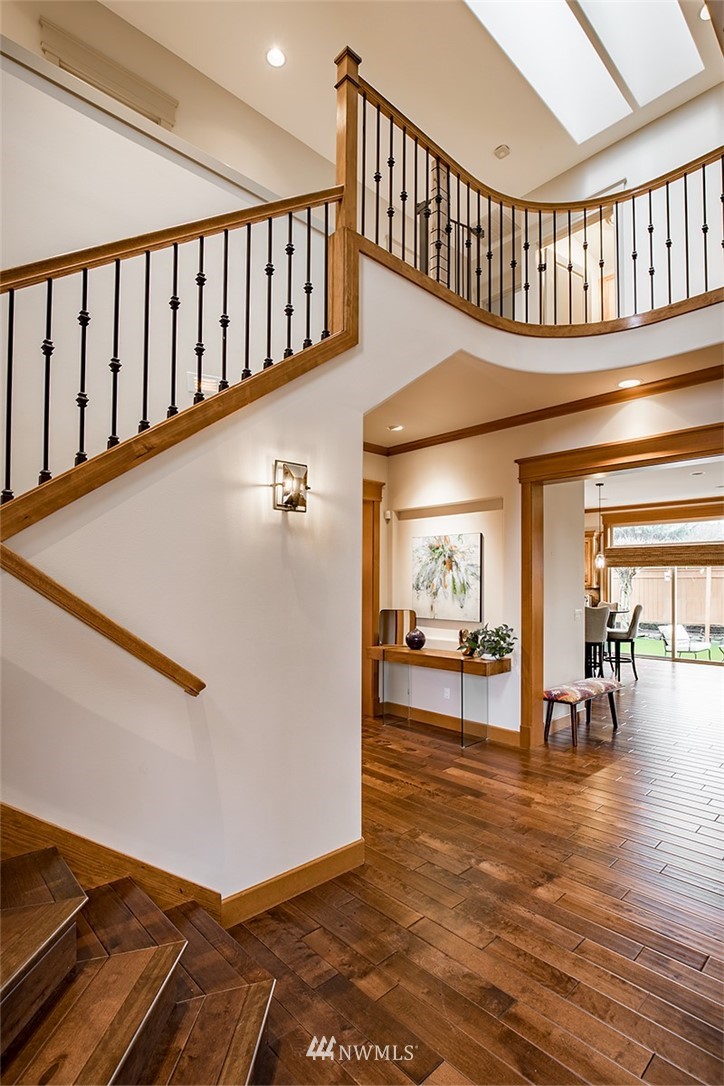 907 North 35th Street Renton, WA 98056 - Photo 6 of 37 a view of interior of living room and dining room with wooden floor