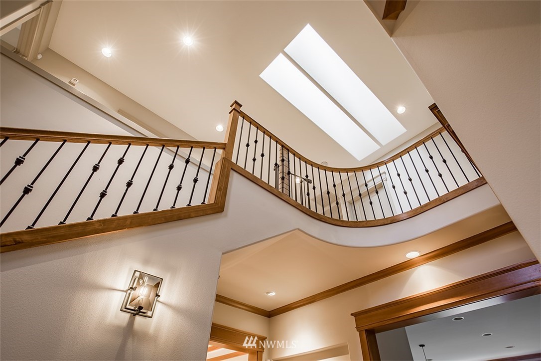 907 North 35th Street Renton, WA 98056 - Photo 8 of 37 a view of an entryway wooden floor and staircase