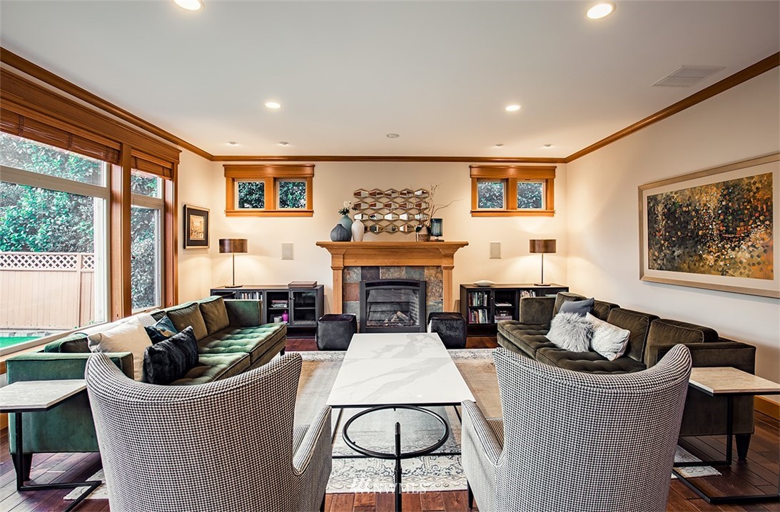 907 North 35th Street Renton, WA 98056 - Photo 10 of 37 a living room with furniture a flat screen tv and a fireplace