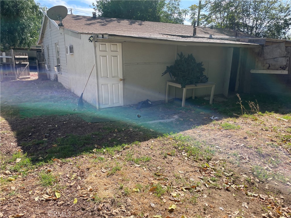 1543 West Orange Grove Avenue Pomona, CA 91768 - Photo 3 of 11 a backyard of a house with table and chairs