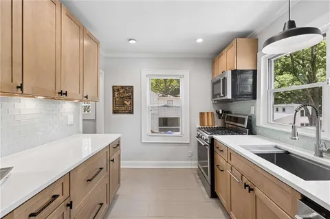 a view of cabinets with wooden floor